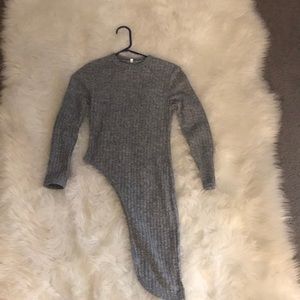 Grey sweater that has the side out